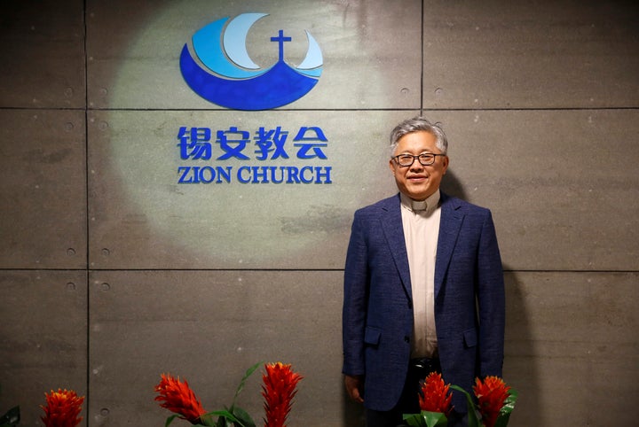 Jin Mingri, head pastor of Beijing's Zion church, poses in the lobby of the unofficial Protestant "house" church on August 28, 2018. The church <a href="https://www.apnews.com/c09b2ee4b71540c8a7fd6178820c5970" target="_blank" role="link" class=" js-entry-link cet-external-link" data-vars-item-name="was shut down" data-vars-item-type="text" data-vars-unit-name="5b97d4b0e4b0cf7b0043d9ae" data-vars-unit-type="buzz_body" data-vars-target-content-id="https://www.apnews.com/c09b2ee4b71540c8a7fd6178820c5970" data-vars-target-content-type="url" data-vars-type="web_external_link" data-vars-subunit-name="article_body" data-vars-subunit-type="component" data-vars-position-in-subunit="0">was shut down</a> on Sunday by government workers.