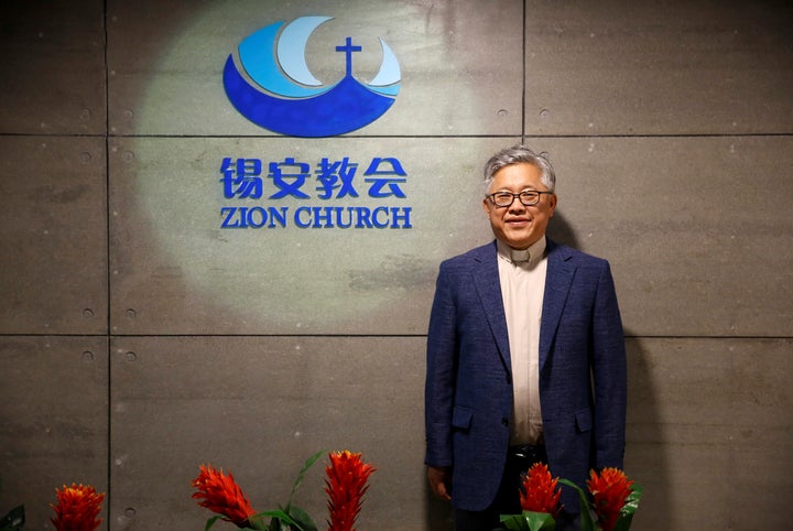 Jin Mingri, head pastor of Beijing's Zion church, poses in the lobby of the unofficial Protestant "house" church on August 28, 2018. The church was shut down on Sunday by government workers.