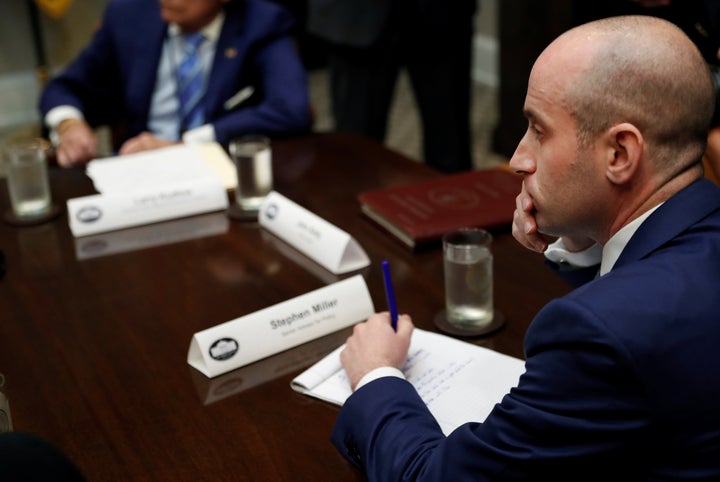 White House policy advisor Stephen Miller takes notes as U.S. President Donald Trump holds a meeting with Republican House an