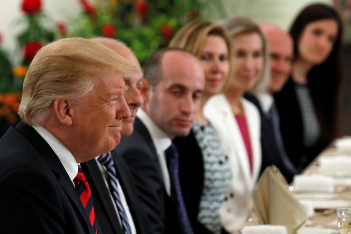 U.S. President Donald Trump and members of his delegation, including White House Senior Advisor Stephen Miller, attend lunch
