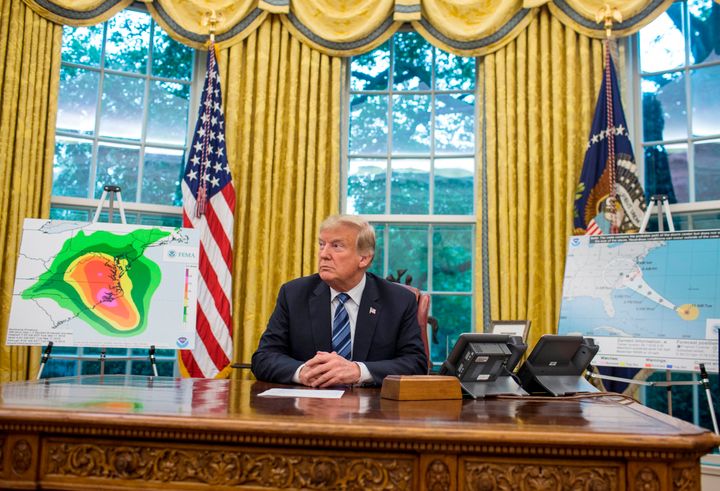 President Donald Trump is pictured following a briefing on Hurricane Florence in the Oval Office at the White House on Tuesday. Trump urged residents in evacuation areas to heed local authorities' warnings.