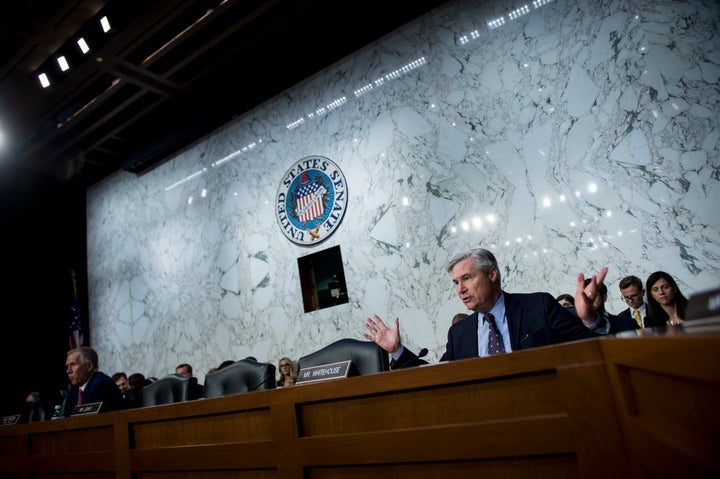 Sen. Sheldon Whitehouse (D-R.I.) questions Supreme Court nominee Brett Kavanaugh as he testifies during a hearing in front of