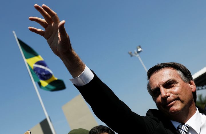 Far-right candidate Jair Bolsonaro, a leading contender in Brazil's presidential race, waves during a military event earlier this year in Sao Paulo. Bolsonaro, a former Army officer, has praised the military dictatorship that ruled Brazil from 1964-1985.