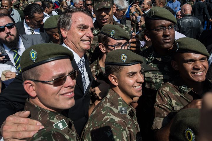 Bolsonaro is seen surrounded by troops at the Sao Paulo event.
