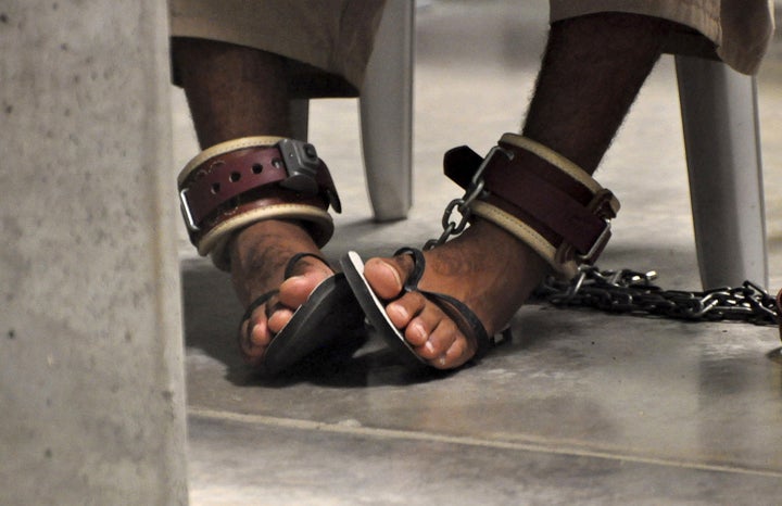 A Guantanamo detainee's feet are shackled to the floor as he attends a "Life Skills" class inside Guantanamo Bay.