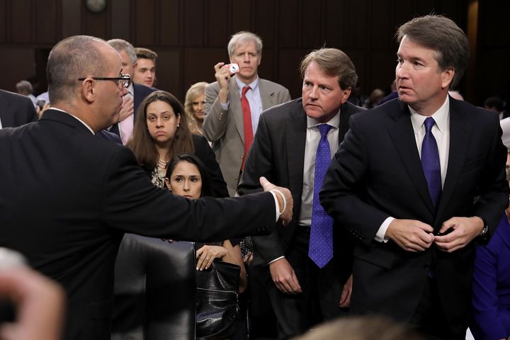 "If I had known who he was, I would have shaken his hand, talked to him, and expressed my sympathy," Kavanaugh, right, said of Fred Guttenberg, left.