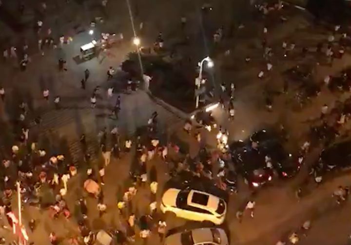 Screengrab shows people fleeing a pedestrian area in the Chinese city of Hengyang in Hunan province after a driver plowed a vehicle into the crowded square.