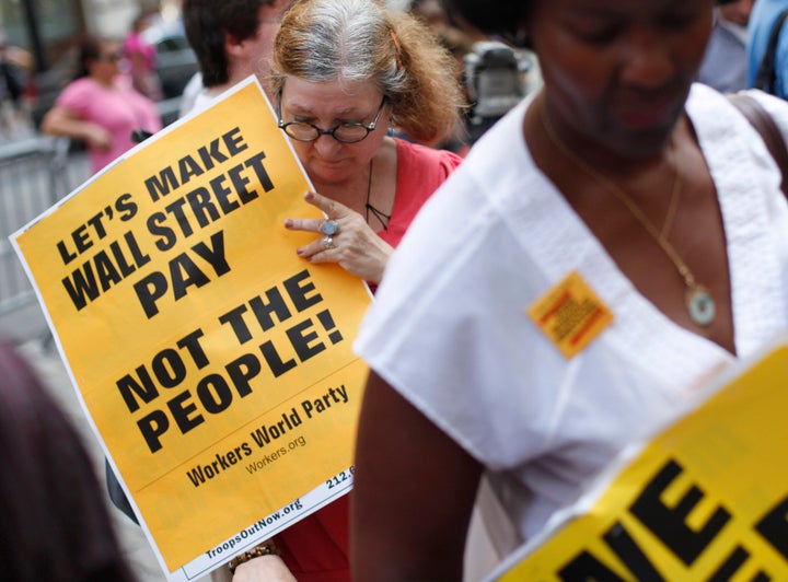 Activists near Wall Street in New York City in August 2011 protest the massive budget cuts being proposed in the debt-ceiling talks.