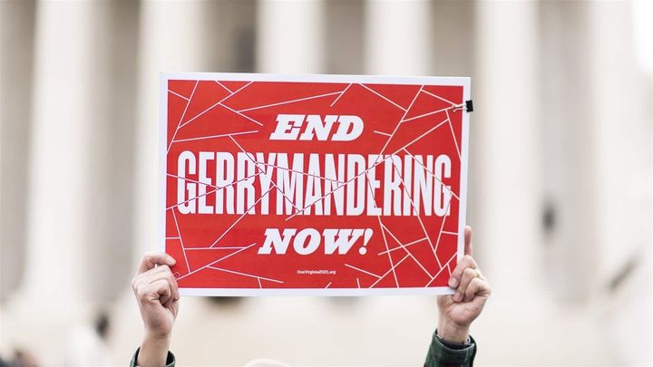 Gerrymandering opponents gather on the steps of the Supreme Court in March. Some states are adopting independent commissions to redraw congressional districts and avoid gerrymandering court battles. 