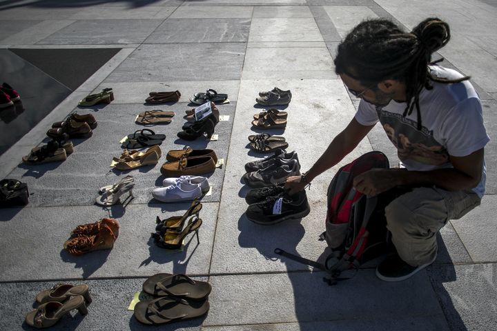 A demonstrator places an empty pair of shoes outside the Capitol building in San Juan, Puerto Rico, during a June 1, 2018, protest against the government's reporting of the death toll from Hurricane Maria.