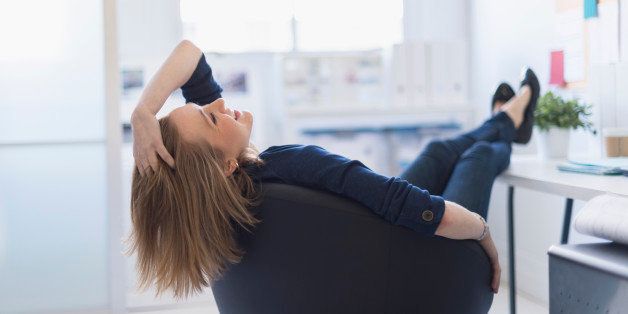 USA, New Jersey, Jersey City, Business woman relaxing in office