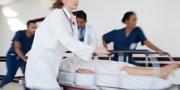 Hospital staff rushing patient to operating room