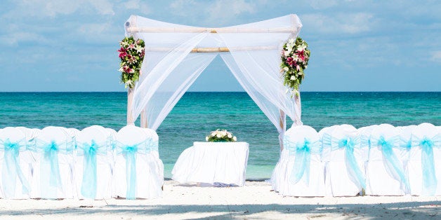 A wedding beach gazebo in a tropical location waiting for the bride and groom to arrive.