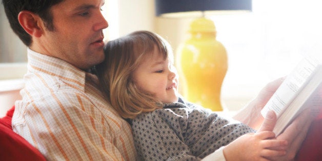 Father and daughter reading