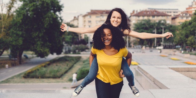 Mixed race girls having fun in the park