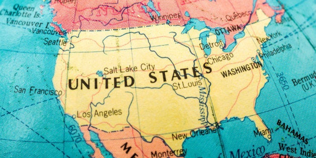 Macro close-up image of an unidentified map of the United States of America in color with surrounding borders