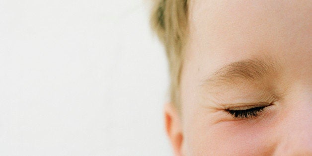 Boy (4-6), eyes closed, section, close-up