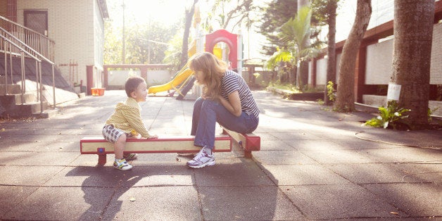 Mother is talking to child under glory sunshine