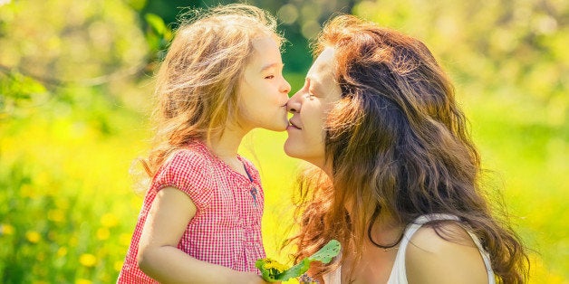 Mother and daughter in spring sunny park