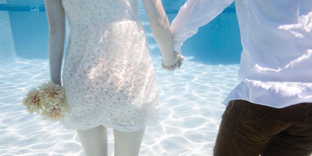 USA, Utah, Orem, Wedding couple under water