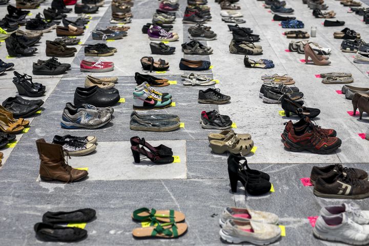 Empty pairs of shoes sit outside the Capitol building in San Juan, Puerto Rico, during a June 1, 2018, protest against the government's reporting of the death toll from Hurricane Maria. 