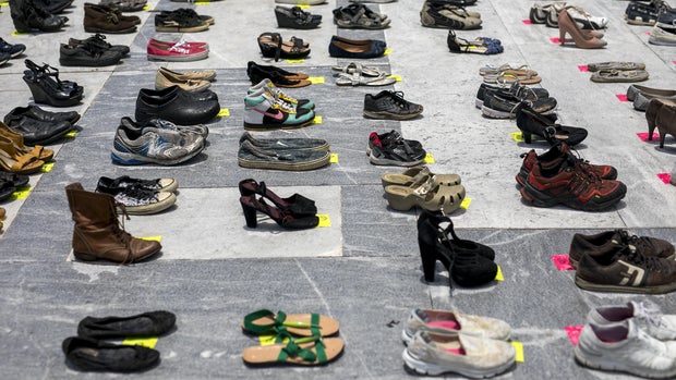 Empty pairs of shoes sit outside the Capitol building during a protest against the government's reporting of the death toll from  Hurricane Maria in San Juan, Puerto Rico, on Friday, June 1, 2018. Hurricane Maria probably killed about 5,000 people in Puerto Rico last year even though the official count remains at just 64, according to a Harvard University study released Tuesday. Photographer: Xavier Garcia/Bloomberg via Getty Images