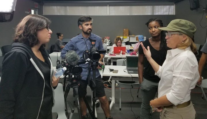 The author (left) and members of HuffPost's video team speak with San Juan Mayor Carmen Yulín Cruz Soto in October 201
