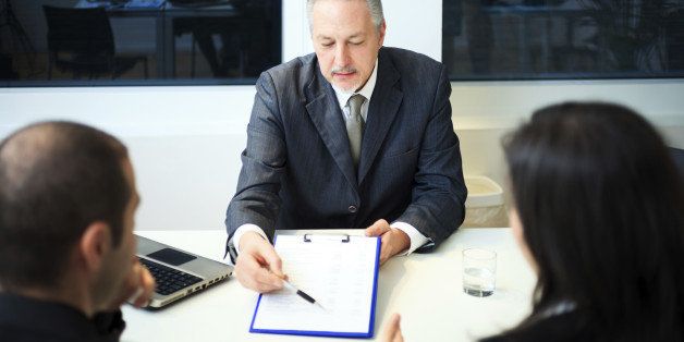 Senior businessman showing a document