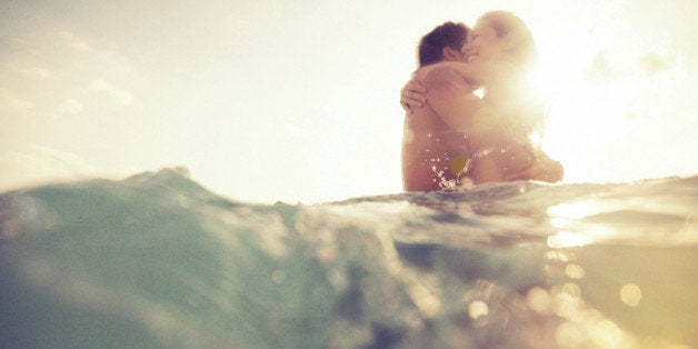 young couple having fun in the sea