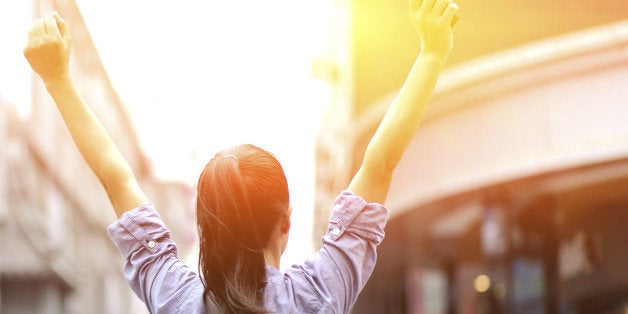 young asian woman open arms on the shopping street