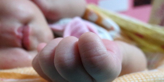 one month old baby girl sleeping a sound sleep.