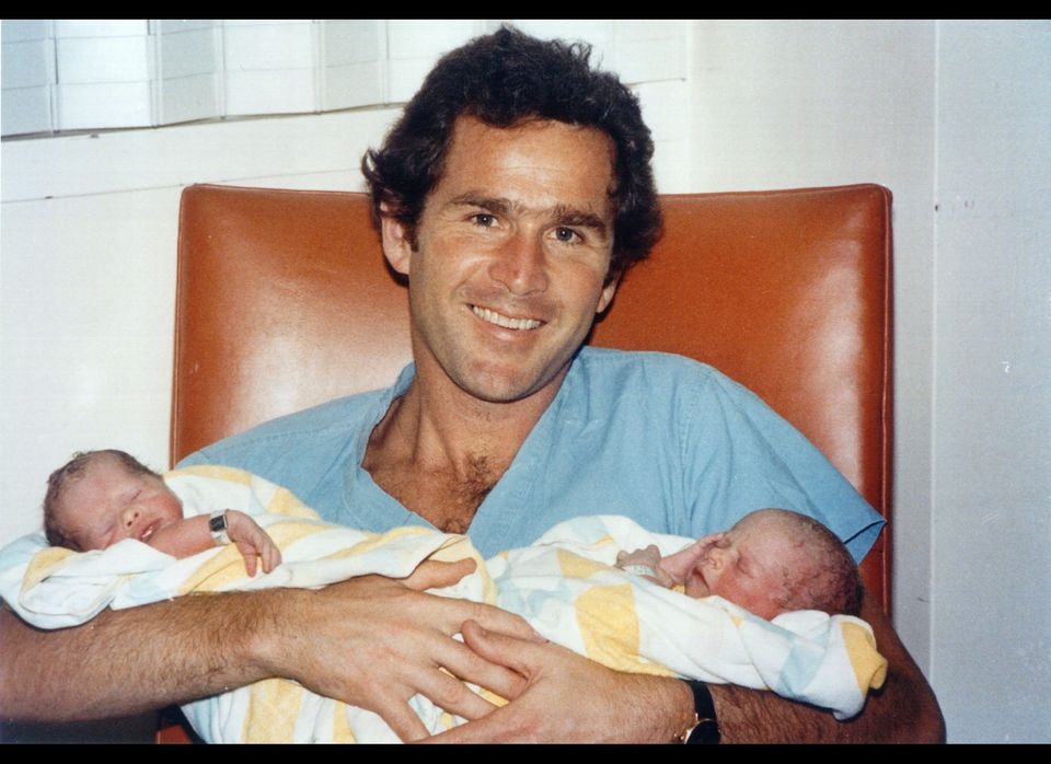George Bush holds the twins in 1981