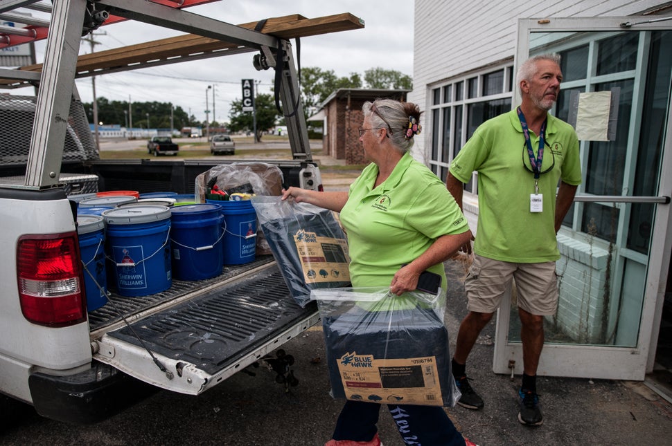 Anne and Jeff Wade loaded their pickup with supplies early Thursday in Lumberton.