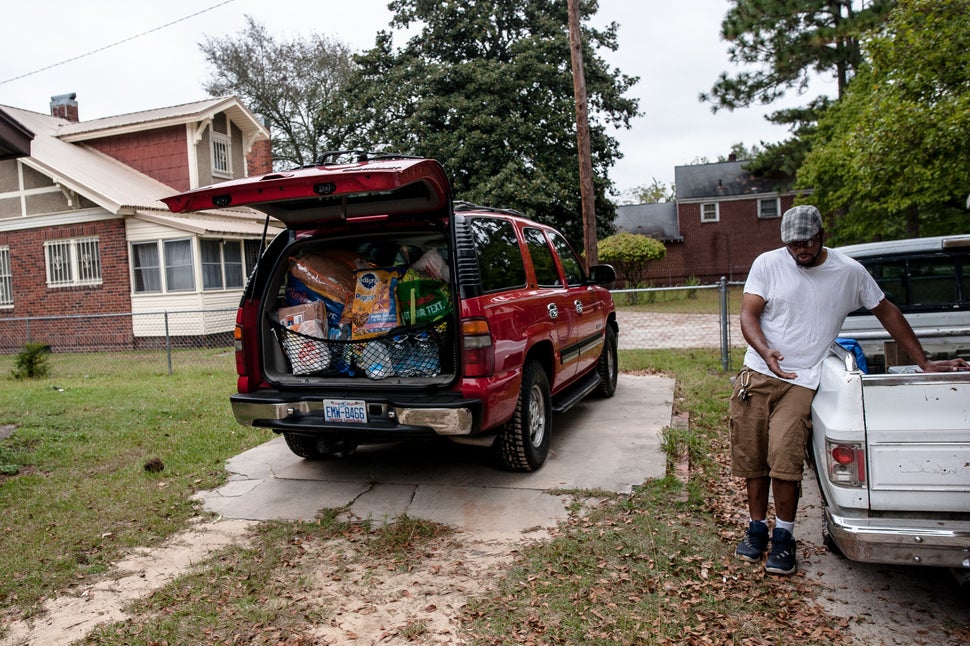 Matthew Peterson has his SUV packed and was loading up his pickup as his family prepared to evacuate their home in Lumberton,