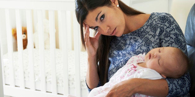 Tired Mother Suffering From Post Natal Depression