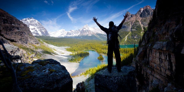 A hiker in the Canadian Rockies above Lake O'hara, Yoho National Park, Canada.