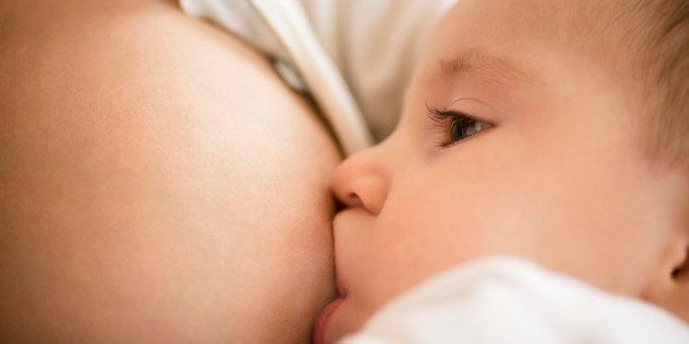 USA, New Jersey, Mother breastfeeding her daughter (2-5 months)