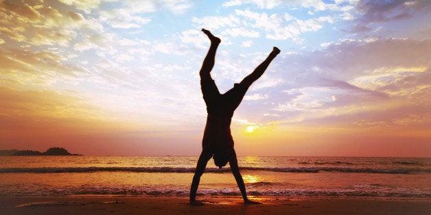 man jumping on the beach