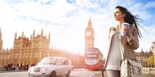 Female tourist walking with luggage at Big Ben in London. See my other photos from London: http://www.oc-photo.net/FTP/icons/london.jpg