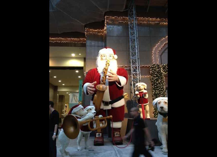 A Giant Santa & His Trumpet Playing Dogs