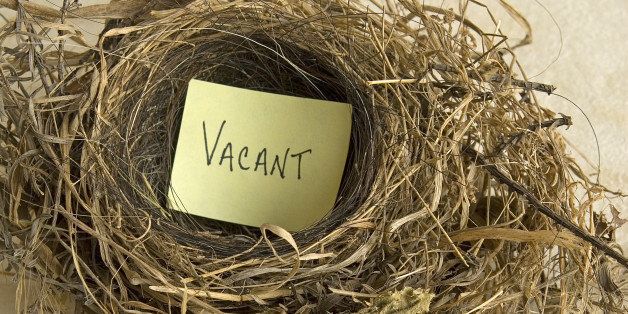 empty nest with a sign that says, Vacant