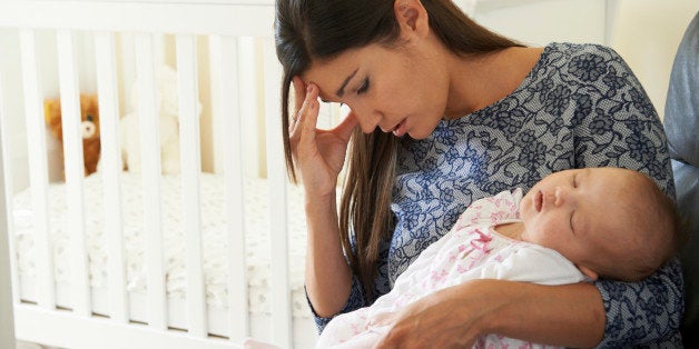 Tired Mother Suffering From Post Natal Depression