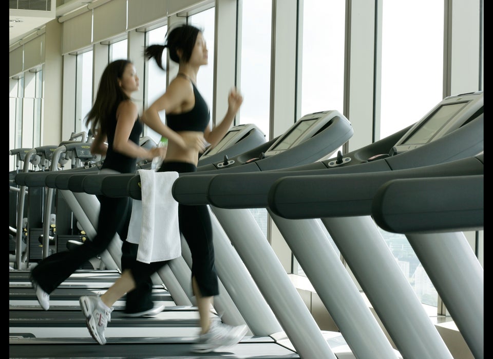 Young petite woman exercising on ski machine in the gym Stock Photo - Alamy