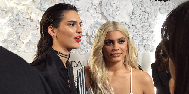 Sisters Kendall Jenner, left, and and Kylie Jenner speak to the media at a party for their KENDALL + KYLIE collection in downtown Manhattan on Wednesday, Sept 7, 2016. Their fashion collection includes clothing, footwear and handbags. (AP Photo/Jocelyn Noveck)