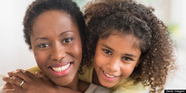 Portrait of smiling mother and daughter (6-7)