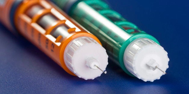 Two insulin syringe pen on a blue background