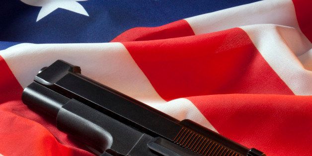 A handgun on the flag of the United States of America.