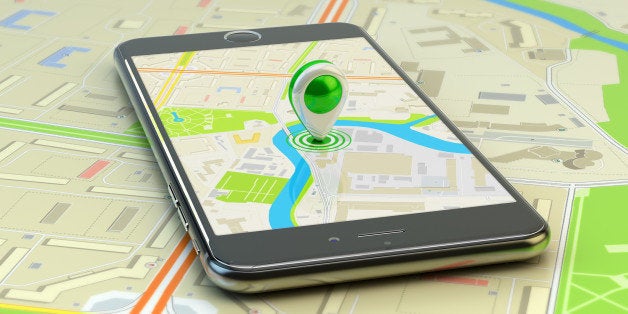 Smartphone with city map application and marker pin pointer on phone screen