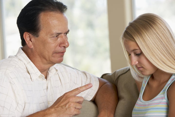 Man Having A Serious Talk With His Daughter