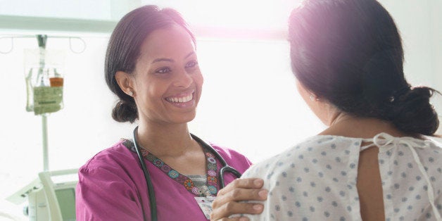 Nurse talking to patient in hospital room